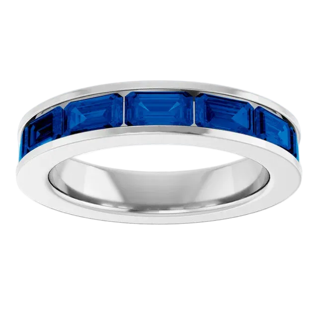 Silver ring with blue gemstones on a white background