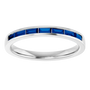 white gold ring with blue gemstones on a white background, an anniversary band