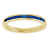 Gold ring with blue gemstones on a white background