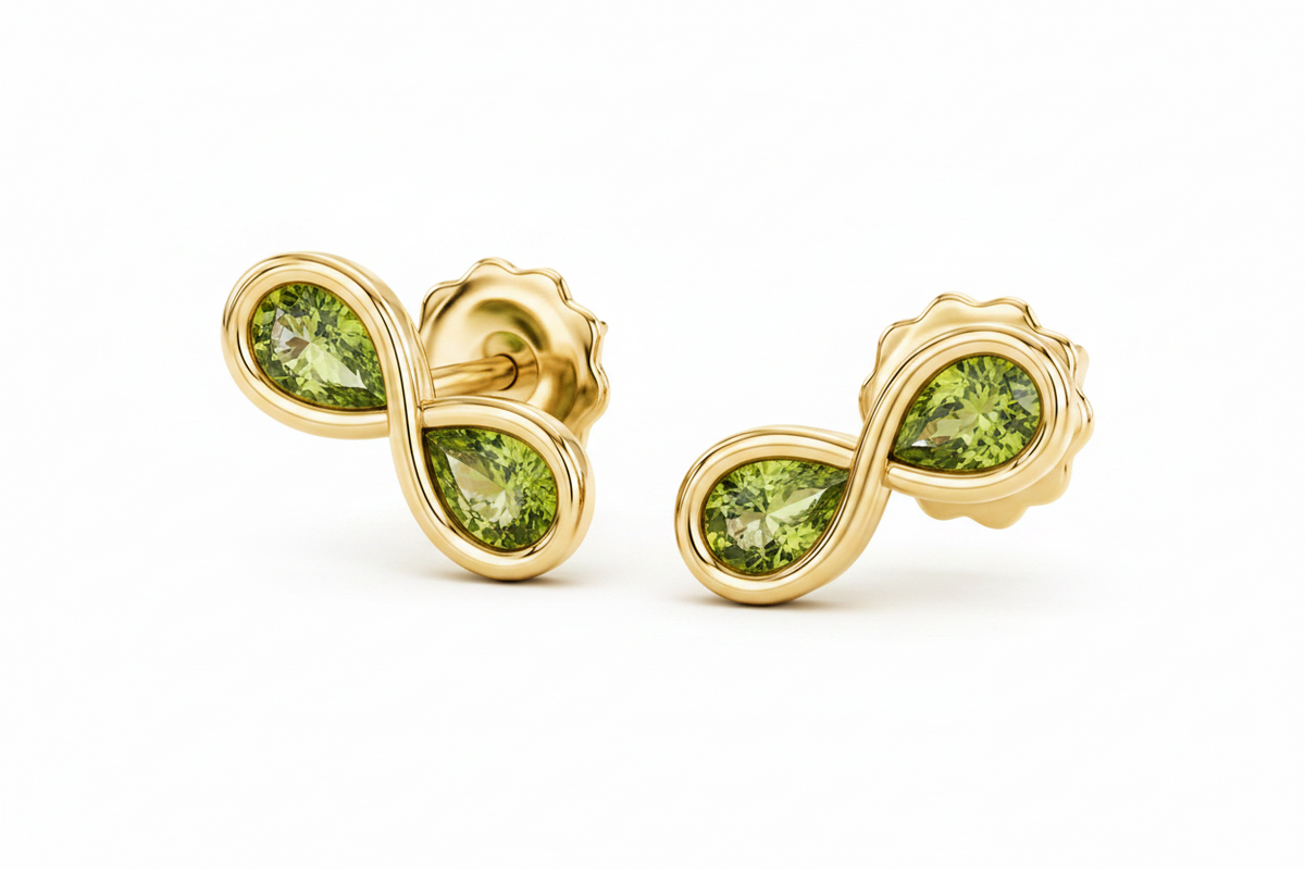 Gold earrings with diamond accents on a white background