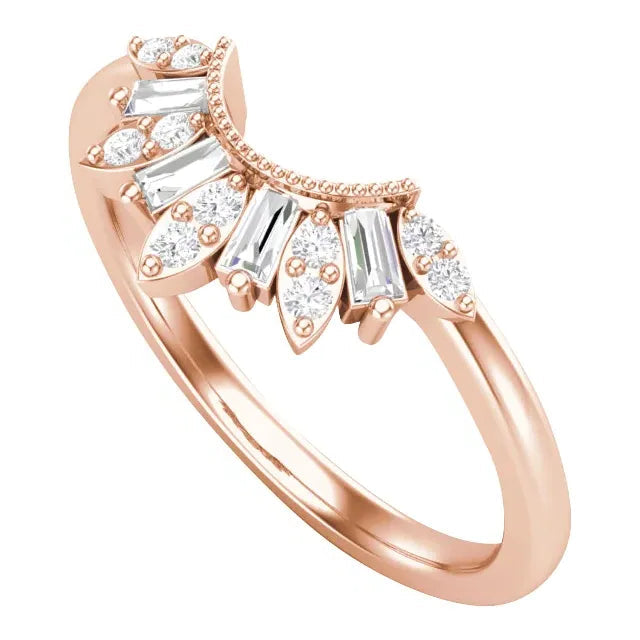 Rose gold ring with diamond accents on a white background